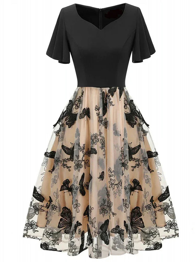 Stijlvolle midikleed van mesh met borduursel en volantmouwen – Maila